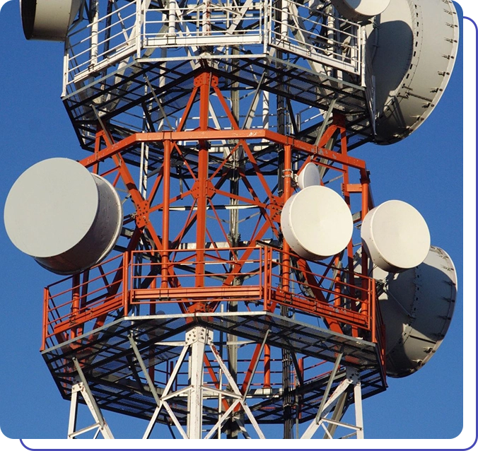 A large tower with many satellite dishes on top.