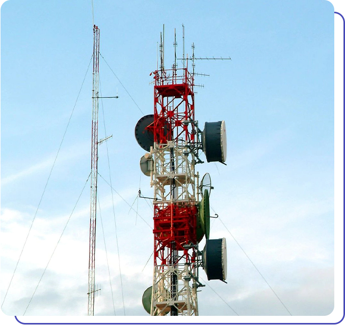 A tall tower with many antennas on top of it.